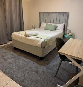 Ένα ή περισσότερα κρεβάτια σε δωμάτιο στο Maqoco Guesthouse