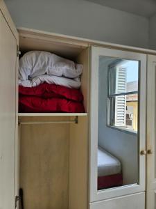 En eller flere senge i et værelse på Edifício Açucena Beira Mar - Praia do Tombo