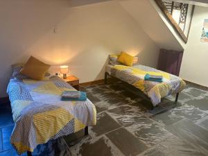 Postel nebo postele na pokoji v ubytování The Shippon at RoseHip