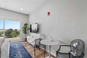 a living room with a table and two chairs at Inn at Seacrest Beach 409 in Inlet Beach
