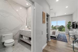 a bathroom with a toilet and a sink at Inn at Seacrest Beach 409 in Inlet Beach +23 photos