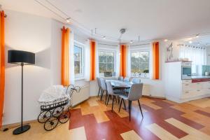 a kitchen and dining room with a table and chairs at Haus Köll - by myNests in Öblarn