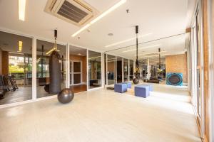 an empty lobby with a ballroom with blue chairs at Premium Modern Studio in Alphaville in Santana de Parnaíba
