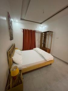 Postel nebo postele na pokoji v ubytování Keur back to teranga Cozy F2 calme aux Mamelles