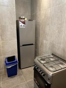 Kuchyň nebo kuchyňský kout v ubytování Keur back to teranga Cozy F2 calme aux Mamelles