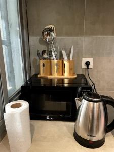 Kuchyň nebo kuchyňský kout v ubytování Keur back to teranga Cozy F2 calme aux Mamelles