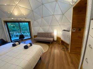 Ένα ή περισσότερα κρεβάτια σε δωμάτιο στο HuellaBlanca