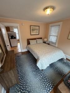 a bedroom with a bed with a blue floor at The Coastal Connection in South Portland