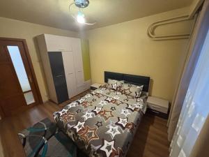 Postel nebo postele na pokoji v ubytování Apartament 2 camere + 5 fotografií