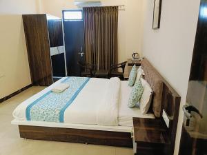 Ένα ή περισσότερα κρεβάτια σε δωμάτιο στο Hotel Jagat Vilas by TC Group