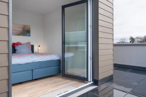 Ένα ή περισσότερα κρεβάτια σε δωμάτιο στο Küste33-22 Lotta