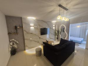 TV a/nebo společenská místnost v ubytování פינוק של סוויטה