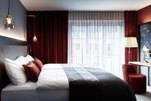 a hotel room with a bed and a window at Sorell Boutique-Hotel Seefeld Zürich in Zurich
