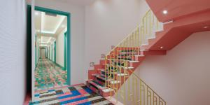 a hallway with colorful stairs in a building at Waldorf Towers South Beach in Miami Beach