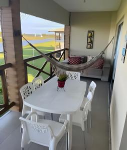 Et opholdsområde på Apartamento em Condomínio Resort