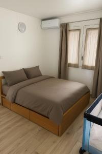 Ένα ή περισσότερα κρεβάτια σε δωμάτιο στο Villa Valey, spacious and authentic