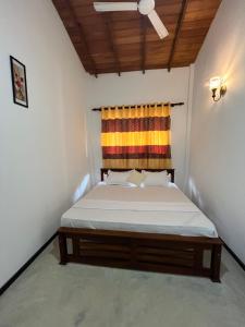 Ένα ή περισσότερα κρεβάτια σε δωμάτιο στο Sunil villa