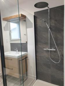 a bathroom with a shower and a sink at Logis Coeur de Bretagne in Bieuzy-les Eaux +20 photos