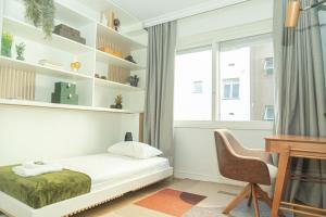 Ένα ή περισσότερα κρεβάτια σε δωμάτιο στο Apto moderno e elegante no Auxiliadora TV7638