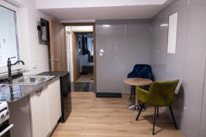 Kuchyň nebo kuchyňský kout v ubytování Novo + 12 fotografií