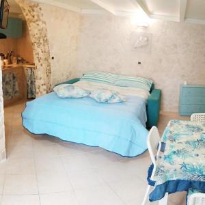 Ένα ή περισσότερα κρεβάτια σε δωμάτιο στο chicca marina