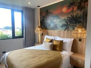 a bedroom with a large bed with two lamps at Hotel Ryo 74b Piso 7 Vip in Medellín