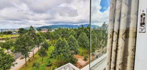 a view from a window of a park with trees at Motel Bờ Kè in Bà Rịa