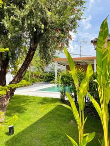 a house with a yard with a swimming pool at Lilly Pool Villa near Krabi Airport with Free Airport Shuttle 