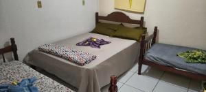 Ein Bett oder Betten in einem Zimmer der Unterkunft Pousada Mar De Estrelas