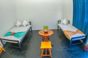 Ένα ή περισσότερα κρεβάτια σε δωμάτιο στο Tangalle Nomad Hub and Coworking Space