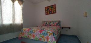 Postel nebo postele na pokoji v ubytování Apartamentos grigri