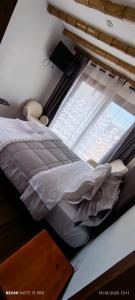 Ένα ή περισσότερα κρεβάτια σε δωμάτιο στο Hospedaje Vientos