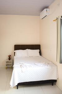 Ένα ή περισσότερα κρεβάτια σε δωμάτιο στο Suíte no cidade Jardim