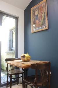 a dining room table with a bowl of fruit on it at Blarney Street in Cork