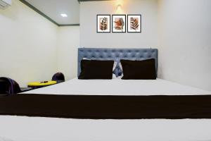 Ένα ή περισσότερα κρεβάτια σε δωμάτιο στο Hotel O Sai Palace