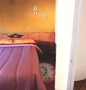 Postel nebo postele na pokoji v ubytování Hospedaje La Casona de los Paredones + 16 fotografií