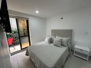 Postel nebo postele na pokoji v ubytování hito 201- Amplio y comodo Apartamento en Laureles