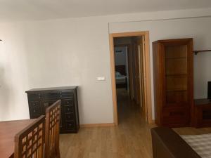 a room with a table and a dresser and a hallway at PISO JUNTO a PAZA MAYOR DE 3 HABITACIONES in Soria