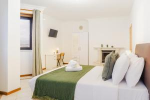 Postel nebo postele na pokoji v ubytování Vistoso Alto Palace