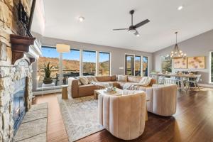 a living room with a couch and a fireplace at Dock Holiday - Hot Tub - Private Dock in Bella Vista