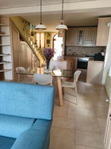 a kitchen and dining room with a table and chairs at Ciliano 16 in Montepulciano