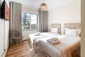 Postel nebo postele na pokoji v ubytování GuestReady- Charming Condo with Pool in Caniço