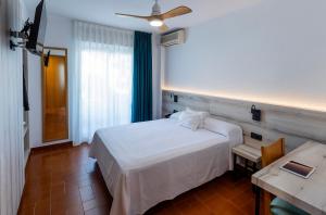 Ένα ή περισσότερα κρεβάτια σε δωμάτιο στο Hotel Bersoca