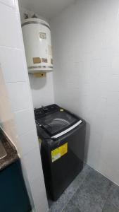 a small bathroom with a trash can in a room at Beautiful apartment in the colonial area of Chacao in Caracas
