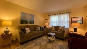 a living room with two couches and a couch at Island Pines in Jekyll Island