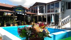 a resort with a swimming pool and a building at Family Hotel Ludo in Varna City