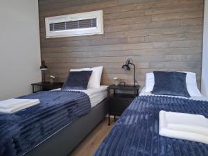 Postel nebo postele na pokoji v ubytování Domki Wilków z widokiem na Łysicę