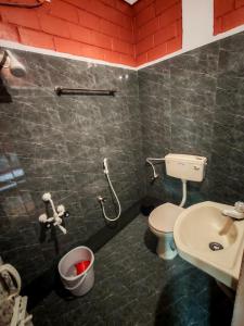 Koupelna v ubytování Srishti Home Stay