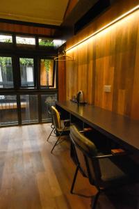 a room with a table and chairs in a room at Playce Hotel in George Town +25 photos