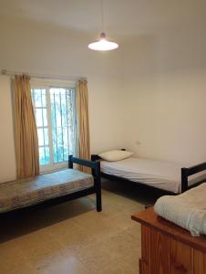 Postel nebo postele na pokoji v ubytování Casa Narnia